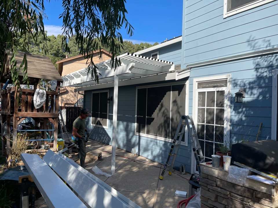wood-beam-patio-lighting Spacious Sacramento, CA, patio with wood beam cover and built-in lighting.
